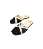 Elegant Design: Black slip-on sandals with crisscross straps adorned with rhinestones.